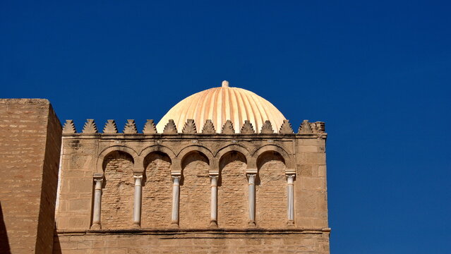 Stone dome above massive stone walls in the Great Mosque of Kairouan in Kairouan, Tunisia