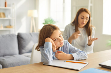 Sad tired teenage boy unwilling to study at home, worried parent mom persuading helping comforting...