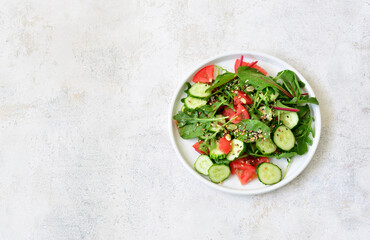 a plate of healthy salad with vegetables and greenery copy space