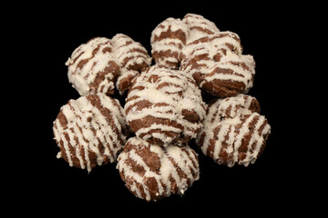 Profiteroles with coconut cream on a black background.