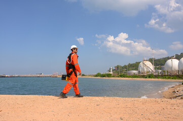 Male engineer checking marine natural gas pipeline project plan