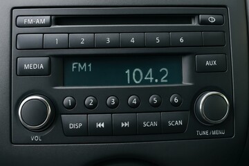 Close-up of Car Radio Display with FM Frequency and Controls