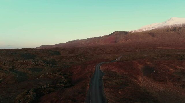 Car Driving Through Rugged Icelandic Landscape Near Glacier