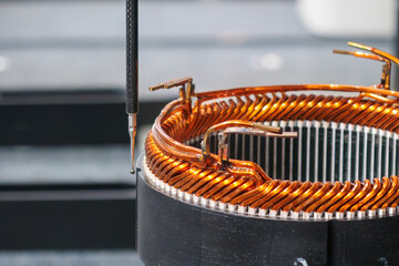 Close up scene the CMM machine working with the electric motor parts.