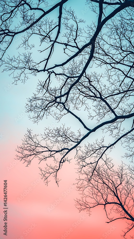 Poster a silhouetted tree branches against a gradient sky, transitioning from soft blue to pink, creating a