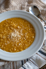 homemade Italian recipe called pastina with creamy vegetables and cheese