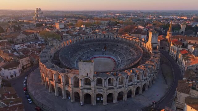 Drone frames ancient arena in waking city of Arles. Aerial drone video
