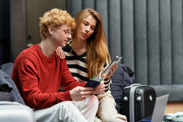 Young couple enjoying intimate moments together in a stylish hotel setting
