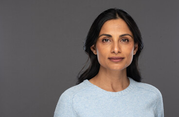Beautiful Asian Indian woman in blue sweater.