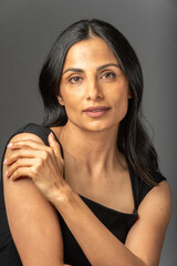 Beautiful Asian Indian woman in studio fashion shoot.