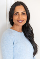 Beautiful Asian Indian woman in blue sweater.