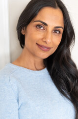 Beautiful Asian Indian woman in blue sweater.