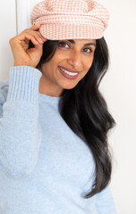 Beautiful Asian Indian woman wearing hat.