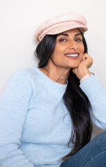 Beautiful Asian Indian woman wearing hat.