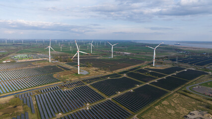 Renewable sustainable energy in Germany. wind turbines and solar panels. Aerial view.