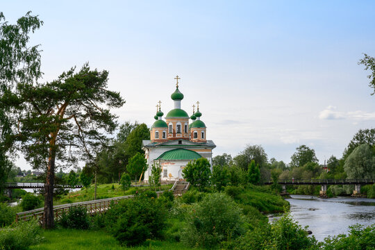 View of the medieval Cathedral of Our Lady of Smolensk on an island among the woods on the Olonka River in Olonets, Karelia, in summer