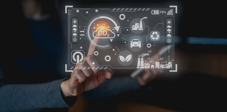A person interacts with a digital interface displaying eco-friendly icons and CO2 metrics, emphasizing technology's role in environmental sustainability.