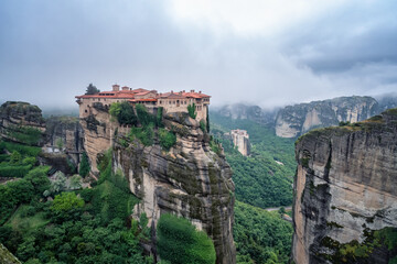 Amazing panoramic view with the majestic Varlaam Monastery in the Meteora Valley near Kastraki, Greece