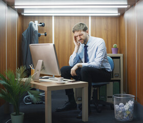 Stressed businessman having a headache