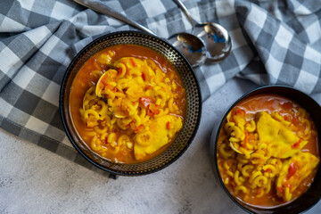 homemade fish and clam noodle casserole recipe in a black bowl