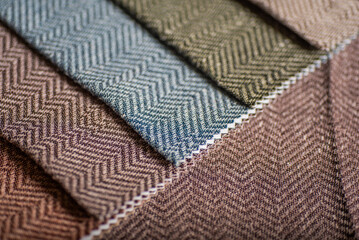 Detailed View of Herringbone Fabric Samples Multi Color Zigzag Pattern Upholstery Textiles