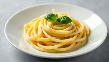 Artistically arranged plate of creamy white pasta, isolated, elegant