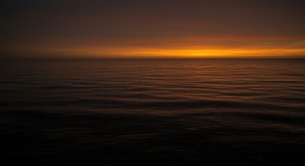 Obraz premium Generative AI - Serene Sunset Over Calm Ocean Horizon with Warm Colors and Reflective Water Surface Creating a Peaceful and Relaxing Seascape Scene at Dusk