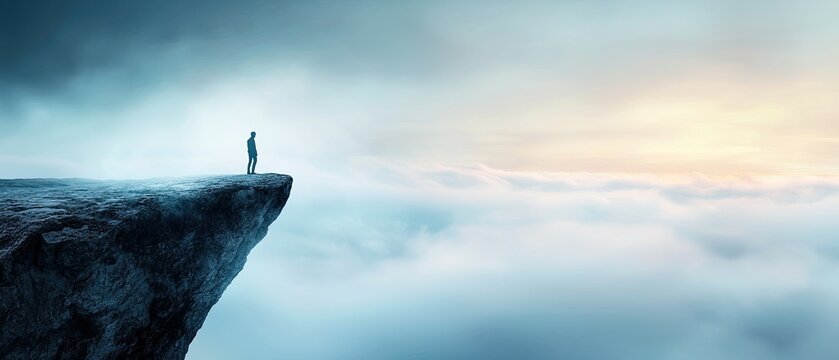 A lone, silhouetted figure stands atop a rugged cliff, gazing out over the vast, open landscape as the sun dips below the horizon, casting a warm glow across the sky.