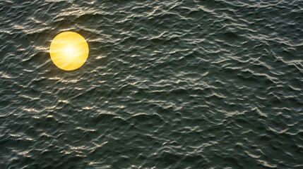 Golden Sun Reflected on Calm Ocean Waves During Sunset