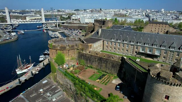 France Brittany Brest Aerial 4K Video Drone Flight Through Recouvrance Bridge with Camera Reveal of Medieval Castle and Harbor Cityscape Atlantic Coast Maritime Fortification Architecture Travel