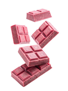 Falling pieces of pink chocolate create dynamic and sweet visual