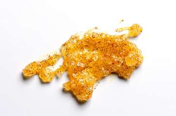 A sample of a cosmetic body care scrub. White background.