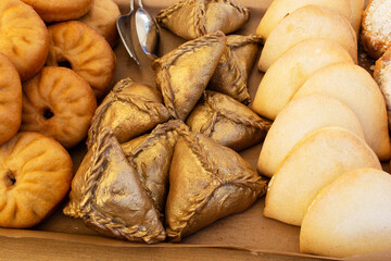 Traditional Tatar food. Peremech, Echpochmak, Sweet buns are on display, ready for sale. National Muslim pastries.