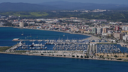 Obraz premium Many white boats mooring in marina with city and mountains in background - GIBRALTAR, UK - MARCH 31, 2025