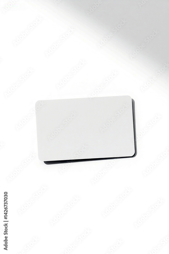 Poster blank white card lies on bright surface. light falls softly. clean template offers space to add cust