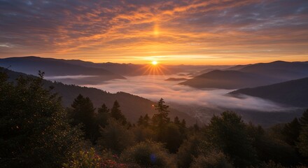 Naklejka premium Sunrise Over Mountains and Fog