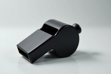 Classic black plastic whistle, simple design, clean background , training, sport