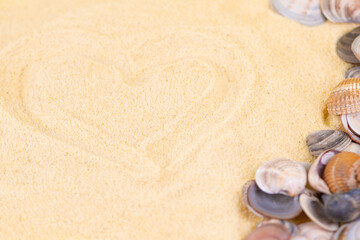 A Beautiful Heart Shape Made in Sand, Surrounded by Delightful Seashells on a Beach
