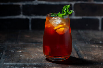 glass of fresh iced tea with lemon and fresh mint