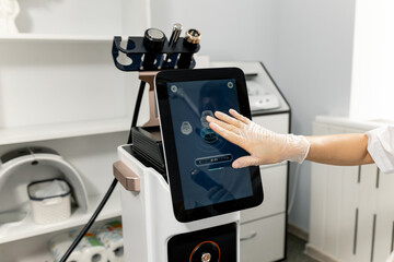 RF body cavitation lifting procedure in a beauty salon. Ultrasound therapy to reduce fat and elasticity of the skin. Cosmetic ultrasonic anti-cellulite massage close-up