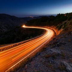 Orange Light Trails, Long Time Exposure Motion Blur Effect,. Cars orange light trails at night in a curve asphalt road at night