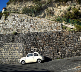 Old car parked on an old road