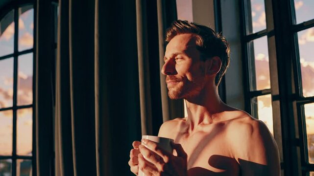 man in briefs enjoying a coffee in the morning