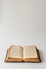 Obraz premium Open old book with blank space above. Education and storytelling concept.