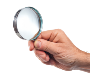 Magnifying glass held by a hand for detailed examination and analysis