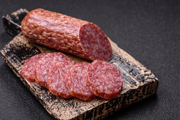 Sliced salami sausage, smoked meat, delicious deli snacks