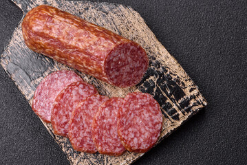 Sliced salami sausage, smoked meat, delicious deli snacks