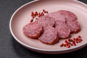 Sliced salami sausage, smoked meat, delicious deli snacks