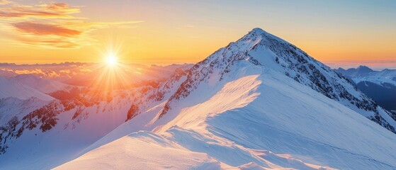 A breathtaking mountain landscape at sunrise, showcasing snow-covered peaks and a vibrant sky with soft clouds.
