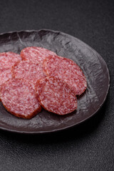 Sliced salami sausage, smoked meat, delicious deli snacks